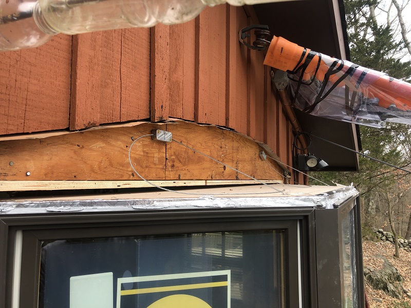 A cable support system supports the weight of this Pella bay window